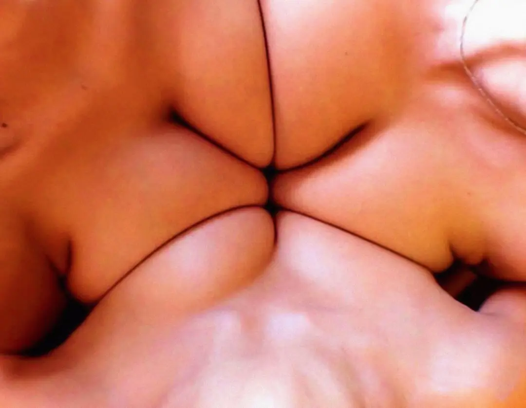 The boob-muda triangle is ready for action with a little baby oil